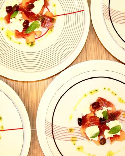 Prosciutto, melon and buffalo mozzarella starter plated for superyacht guests by chef Troy Davidson