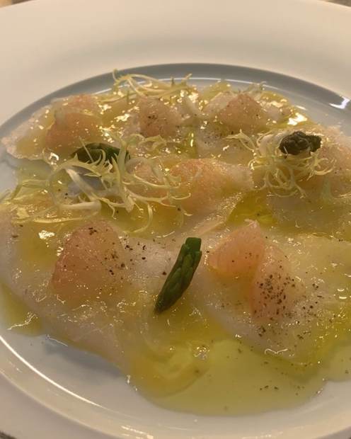 Line-caught fish carpaccio with citrus and asparagus, superyacht seafood course
