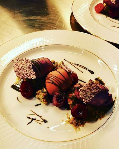 Cherry and sorbet dessert with pistachio crumb plated by superyacht chef Troy Davidson