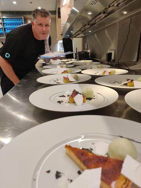 Chef Troy Davidson at the pass during full guest service aboard a superyacht